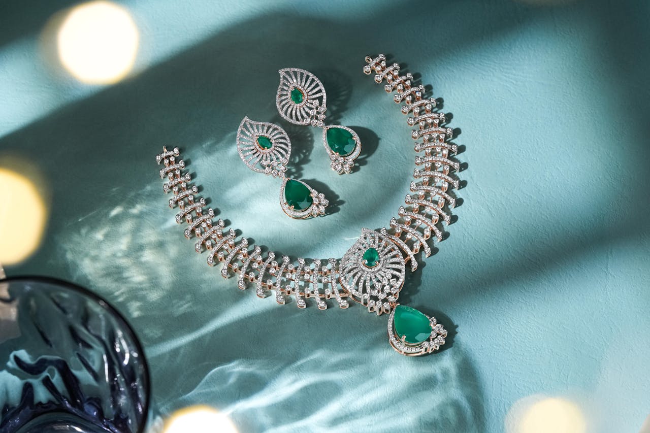 Dazzling diamond and emerald jewelry set beautifully showcased, perfect for festive occasions.